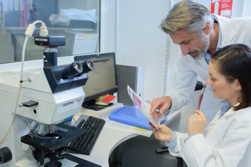 Medical workers looking at document