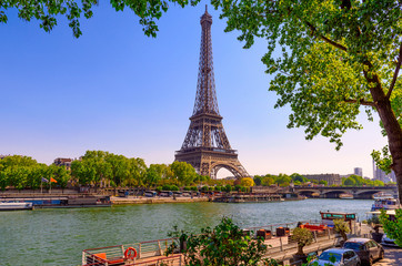 View of Eiffel Tower and river Seine at sunrise in Paris, France. Eiffel Tower is one of the most...