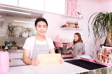 Side job. Young dark-haired man feeling extremely busy while having a side job while having night shifts at the bar