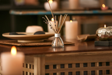 Aroma sticks on table in spa salon