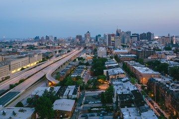 View of Mount Vernon and Downtown at night, in Baltimore, Maryland