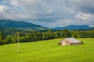 Fototapeta na wymiar View of a farm and mountains in the rural Potomac Highlands of West Virginia.