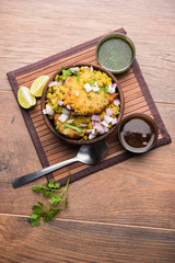 Ragda Pattice is a popular Street food or chat made of potato Patties. served in a steel plate, bowl or ceramic plate with tamarind and cilantro chutney