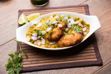 Ragda Pattice is a popular Street food or chat made of potato Patties. served in a steel plate, bowl or ceramic plate with tamarind and cilantro chutney