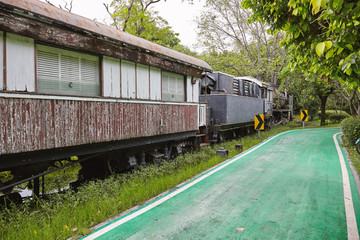 Fototapeta na wymiar BANGKOK, THAILAND - APRIL 7, 2018: Abandoned old train in the city park
