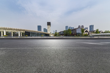 Panoramic skyline and modern business office buildings with empty road,empty concrete square floor