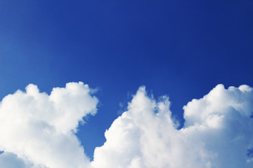 Naklejka na ściany i meble White clouds under the summer blue sky