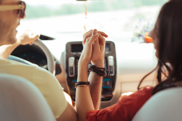 Traditional bracelets. Loving modern couple wearing heir traditional bracelets while traveling...