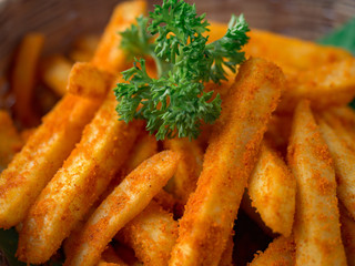 French fried barbeque flavour in wood basket on white wood table.