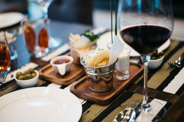 Crispy potato chips. Bowl of home made potato chips served with tomato sauce.