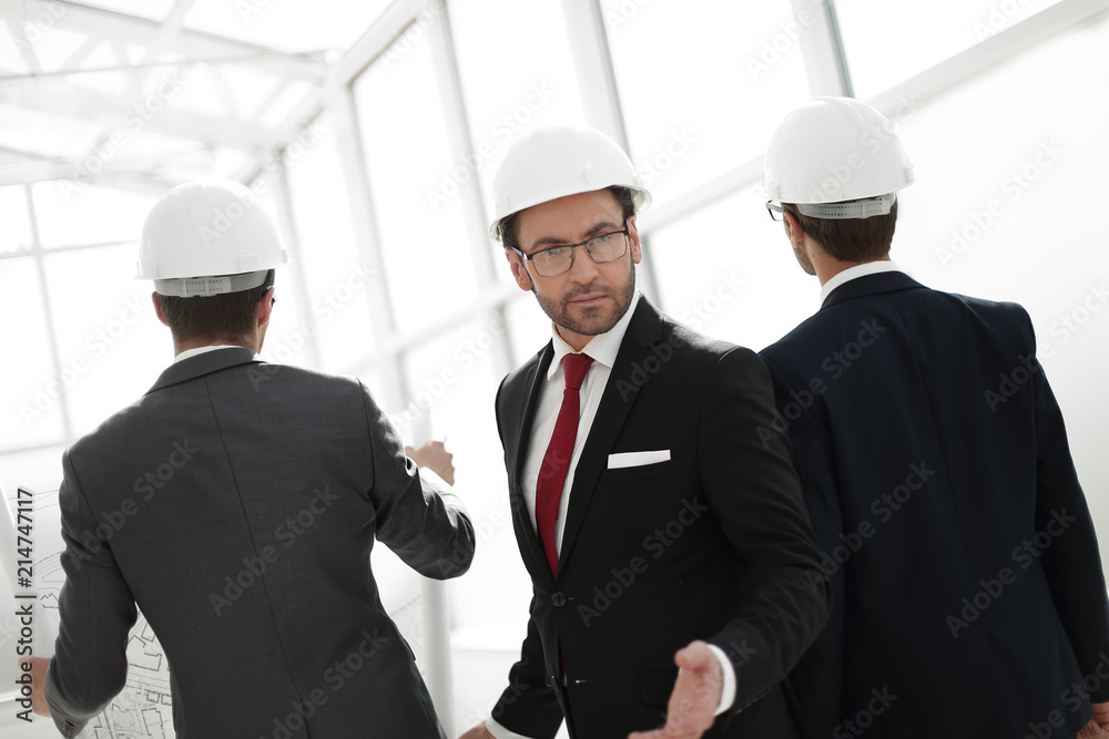 Wall mural rear view.portrait of the architect on the glass office background