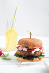 Veggie bean and quinoa burger with fresh vegetables