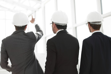 rear view.Architects check documents and workflow in place