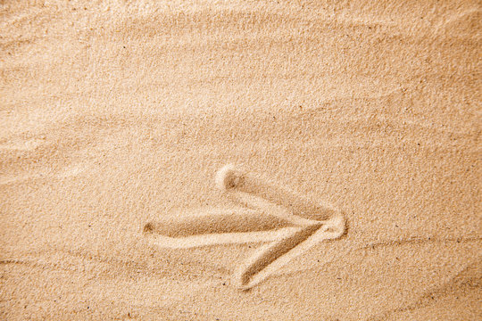 Arrow to the right of the sand