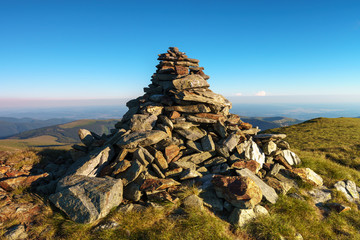 Stack of rocks marking a mountain peak