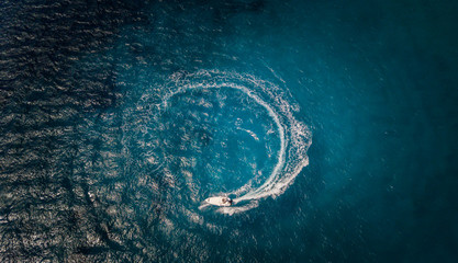 Aerial view of speed boat in circle motion