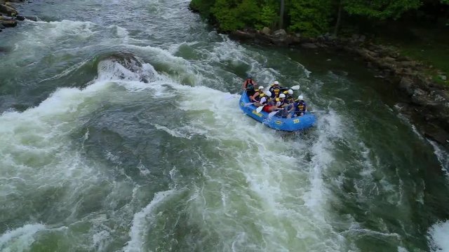 Whitewater rafting down second rapid.