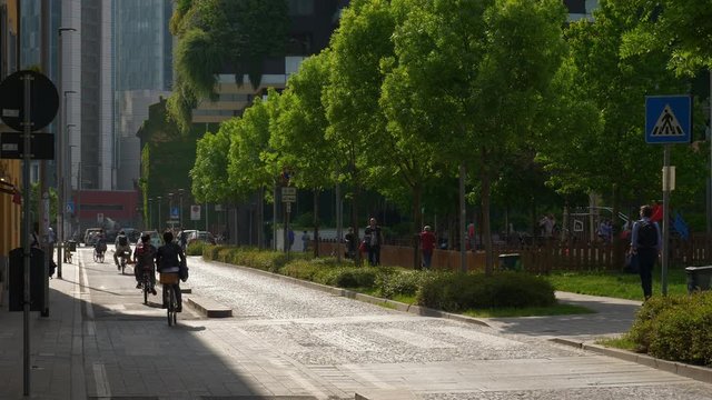 sunny day milan city traffic street living block park slow motion panorama 4k italy
