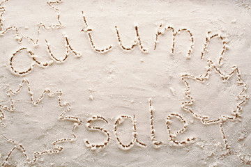 Banner for autumnal sale on white sand