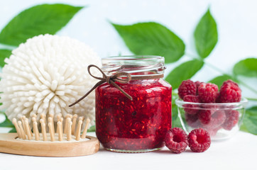 Homemade raspberry jam in a small glass jar. Selective focus,  copy space.