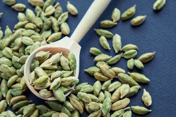 Super food cardamom health food selection in spoon.