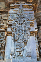 Ornate wall panel reliefs depicting lord Brahma, Chennakesava temple, Belur, Karnataka.
