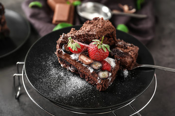 Delicious chocolate cake with berries on plate