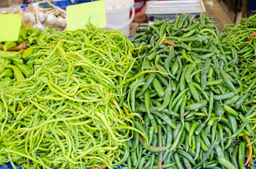 pods of hot green pepper in the bazaar in the summer