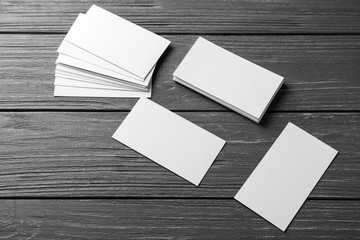 Blank business cards on wooden background