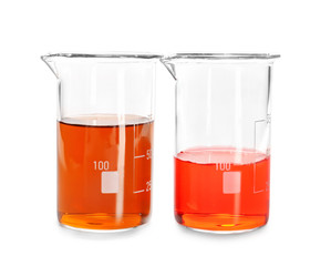 Beakers with color liquids on white background