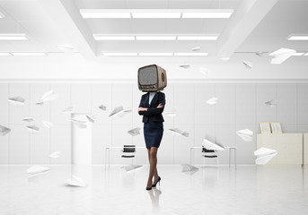 Fototapeta na wymiar Business woman with an old TV instead of head.