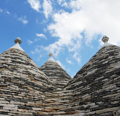 Fototapeta na wymiar Alberobello, Puglia Region, South of Italy. Trulli di Alberobello. Traditional roofs of the Trulli, original and old houses of this region. UNESCO heritage site.