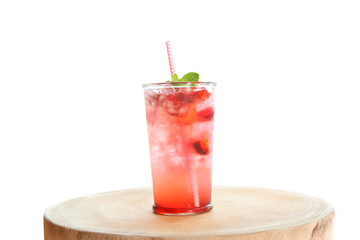 Glass of tasty strawberry lemonade on table against white background