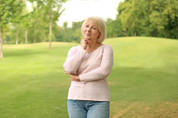 Obraz premium Portrait of beautiful mature woman outdoors