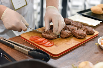 cooking burgers in the restaurant kitchen