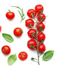 Fresh cherry tomatoes with basil on white background