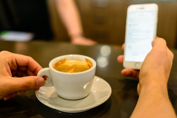 man is taking pictures of coffee