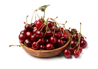 Bowl with ripe cherries on white background