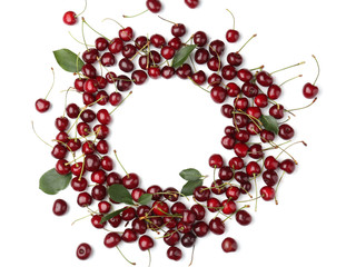 Frame made of ripe cherries on white background