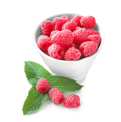 Bowl with delicious fresh ripe raspberries on white background