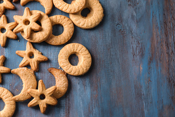 Sweet tasty cookies on wooden table