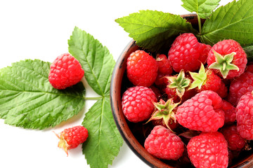 Bowl with ripe aromatic raspberries on white background, closeup