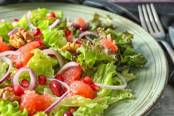 Delicious fresh salad on plate, closeup