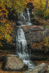 Fototapeta na wymiar A waterfall in autumn