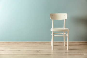 White chair near color wall