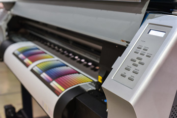 Wide format printer in work. Printing test image