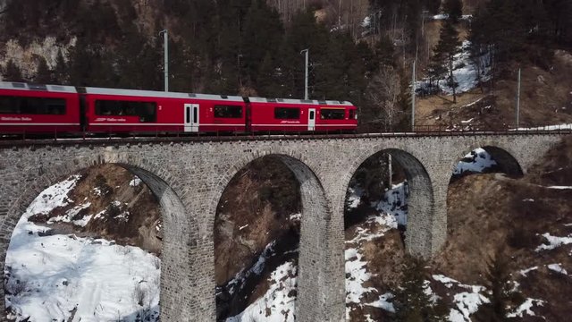 Train on the Landwasser Viaduct in Switzerland in WInter - Aerial View