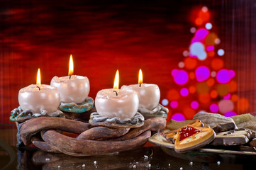 Advent Wreath with Burning Candles onteh Red Background