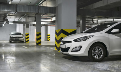 White Cars parked on underground parking. HDR photo