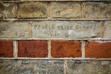 Inscription on the old brick wall "Last time in guard"